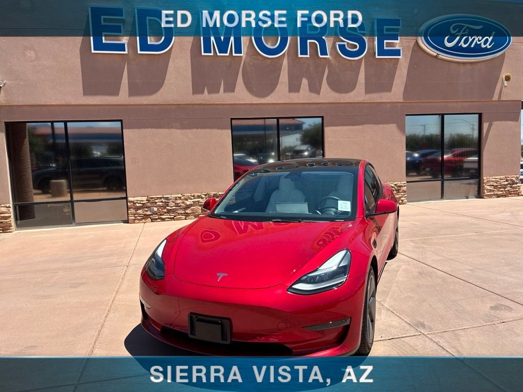 2022 Tesla Model 3 Long Range in Red Multi-Coat — front three-quarter view